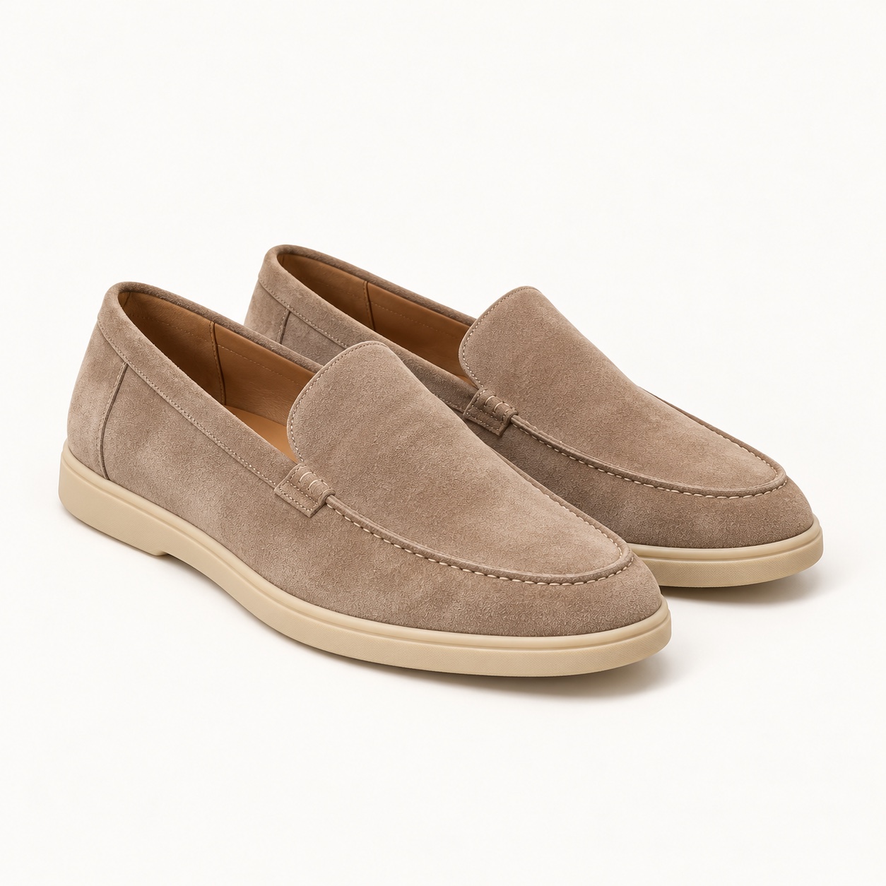 A pair of taupe suede loafers.